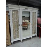 A painted period mirror break front wardrobe