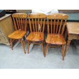 Three traditional pine kitchen chairs