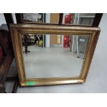 A modern gilt frame wall mirror