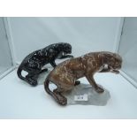 Two Beswick studies, Puma On Rock, both style two, black and tawn 1823