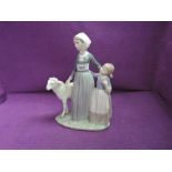 A Lladro figure group, Mother With Child & Lamb 5299, with original box