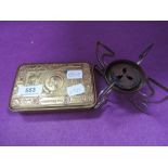 A World War I Christmas 1914 tin containing a small folding stove