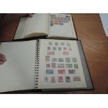 Two stamp albums containing GB and World stamps