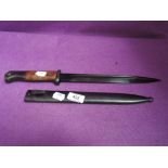 A German Mauser bayonet marked PR8 2657, blue blade with scabbard, good condition