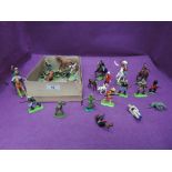 A small selection of Britains and similar plastic figures and on horseback along with farm animals