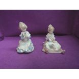 Two Lladro figurines, Loving Valencia 5868 and Girl Reclining with a Bouquet of Flowers