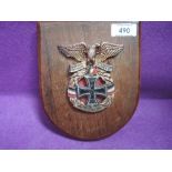 A World War I 1914 German Iron Cross mounted on wreath and eagle, on wood shield