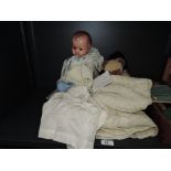 A 1930's Arthur Schoenau, German composition headed doll having sleeps eyes, open mouth with two