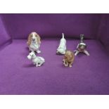 Two Royal Copenhagen studies, Bassett Hound, sitting 4616, Terrier Playing With Shoe 3476, Two