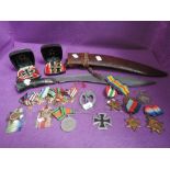 A collection of military items, Kukri knife, two copies Iron Cross, two World War I medals, World