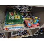 A shelf of vintage games including Wembley, Totopoly, Mouse Trap, Blow Football etc