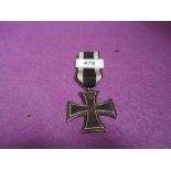 A German Iron Cross dated 1813 with Oak Leaf, FW and Crown, reverse 1870, W Crown with ribbon