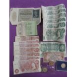 A collection of mainly GB £1, 10/- shilling banknotes, plus a 9ct gold medal