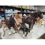 A Beswick study, Burnham Beauty 2309 and two similar smaller shire horse studies, all with carts and