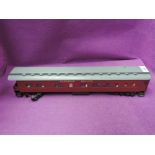 A scratch built 0 gauge Canadian Pacific coach having furniture and lighting