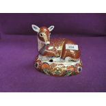 A Royal Crown Derby Collectors Guild Paperweight, Seated Deer having gilt stopper