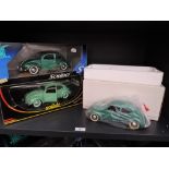 Three Solido Prestige 1:18 scale diecast Beetle cars in various shades of green, all in window