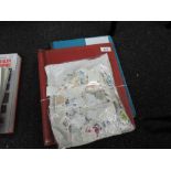 A collection in four albums and a bag of mint and used European stamps including Netherlands and
