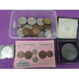 A small collection of coins and a Chronology of The Reigns of England medallion