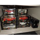 Eleven Burago 1:18 scale diecasts including Mercedes, Porsche, Ferrari and similar, all in