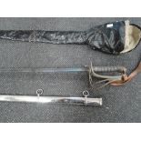 An Edward VII Royal Artillery officer's sword with decorated blade, metal scabbard and water proof