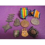 A collection of World War I medals and badges to 158087 C H Graham RA two World War I medals, silver
