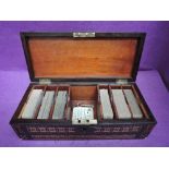A 19th century mahogany and marquetry rectangular playing card box containing six decks of Goodall