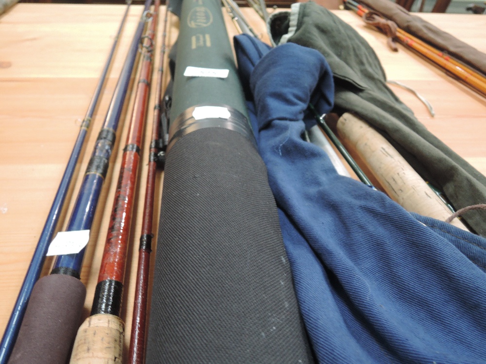 A selection of fishing rods including Scottie 30-50