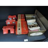 A Bakelite Viewmaster and Light Attachment, both boxed, three later viemasters and a large