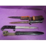 A Swedish model 1896 knife bayonet EJ. AB 11-L7 No111 with leather and metal scabbard, plus a