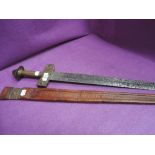 A Nigerian Hausa people sword possibly a Takouba type C1880 with straight blade and cross guard,