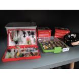 A selection of fishing tackle including flies lures and reel