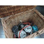 A wicker fishing basket and tackle