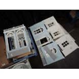 A part built modern two storey dolls house, having many accessories