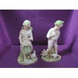 Two early 20th century French bisque figures modelled as farm children with chickens