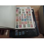 Three albums of World stamps, mint and used