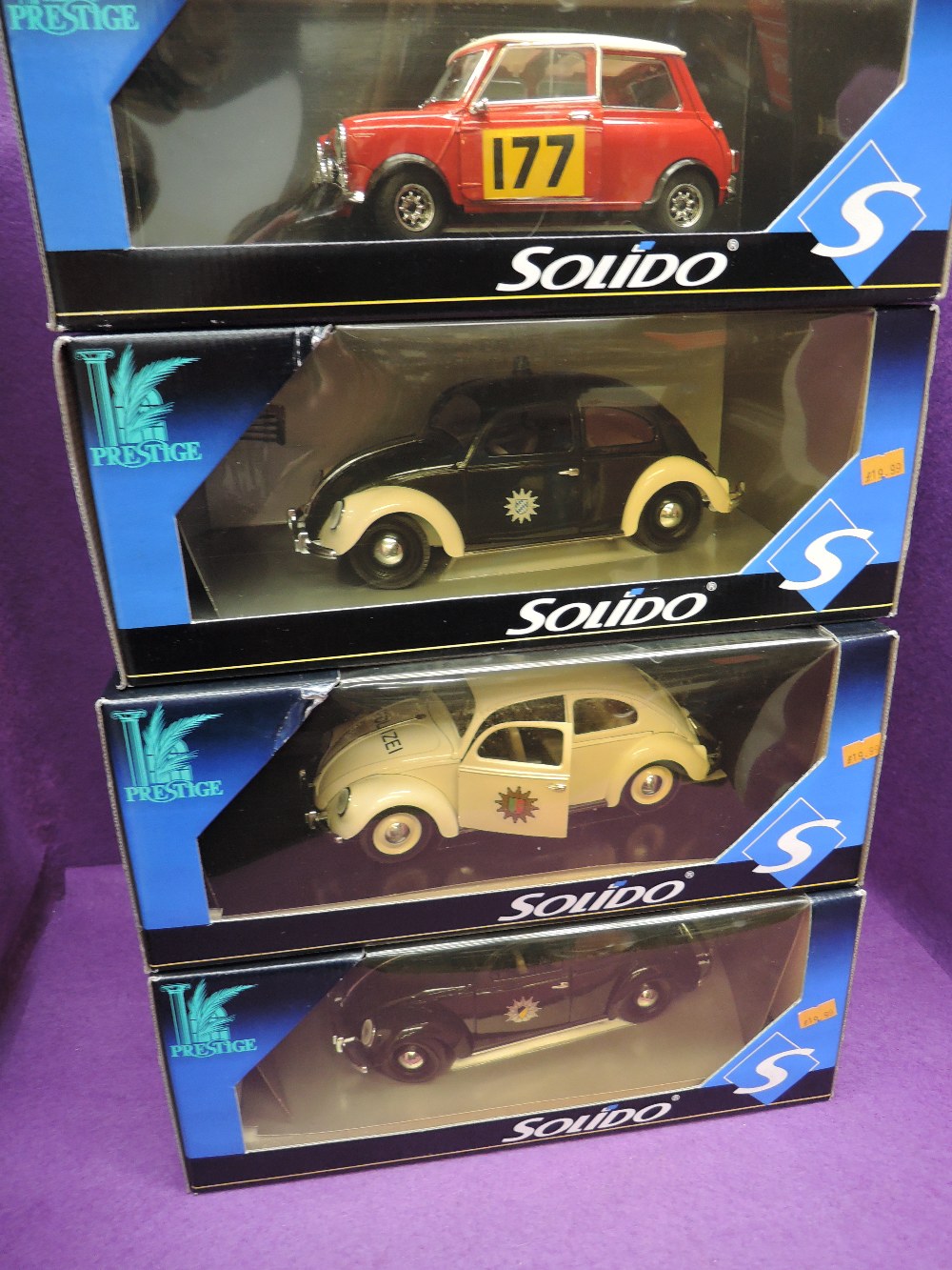 Four Solido Prestige 1:18 scale diecast Polizei and similar police carand a Mini with decal number