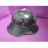 A World War II German Luftschutz beaded M40 helmet with Luftschutz decal on front of helmet,