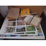 A selection of uncut sheets of Scotland and Lake District postcards, plus stamps