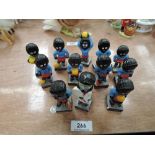 A set of eleven Robertson advertising Football Team figures and a similar Lolipop Lady, (some af)