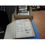 A box of World stamps in albums, loose and on cards