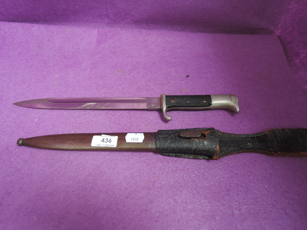 A German dress bayonet, metal scabbard and leather frog, good condition, made by E Pack & Sohne