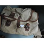 A vintage canvas and leather Hardy fishing tackle bag
