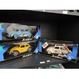 Three Solido Prestige 1:18 scale diecast Beetle cars, Herbie Rides again, Michelin and Milka