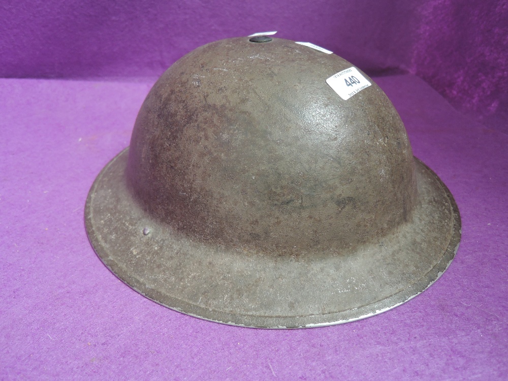 A World War II British Army helmet, marked on inside 1-1939, good condition