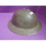 A World War II British Army helmet, marked on inside 1-1939, good condition