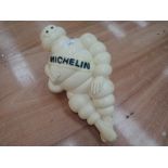 A vintage motoring advertisement mascot the Michelin man marked made in France to base