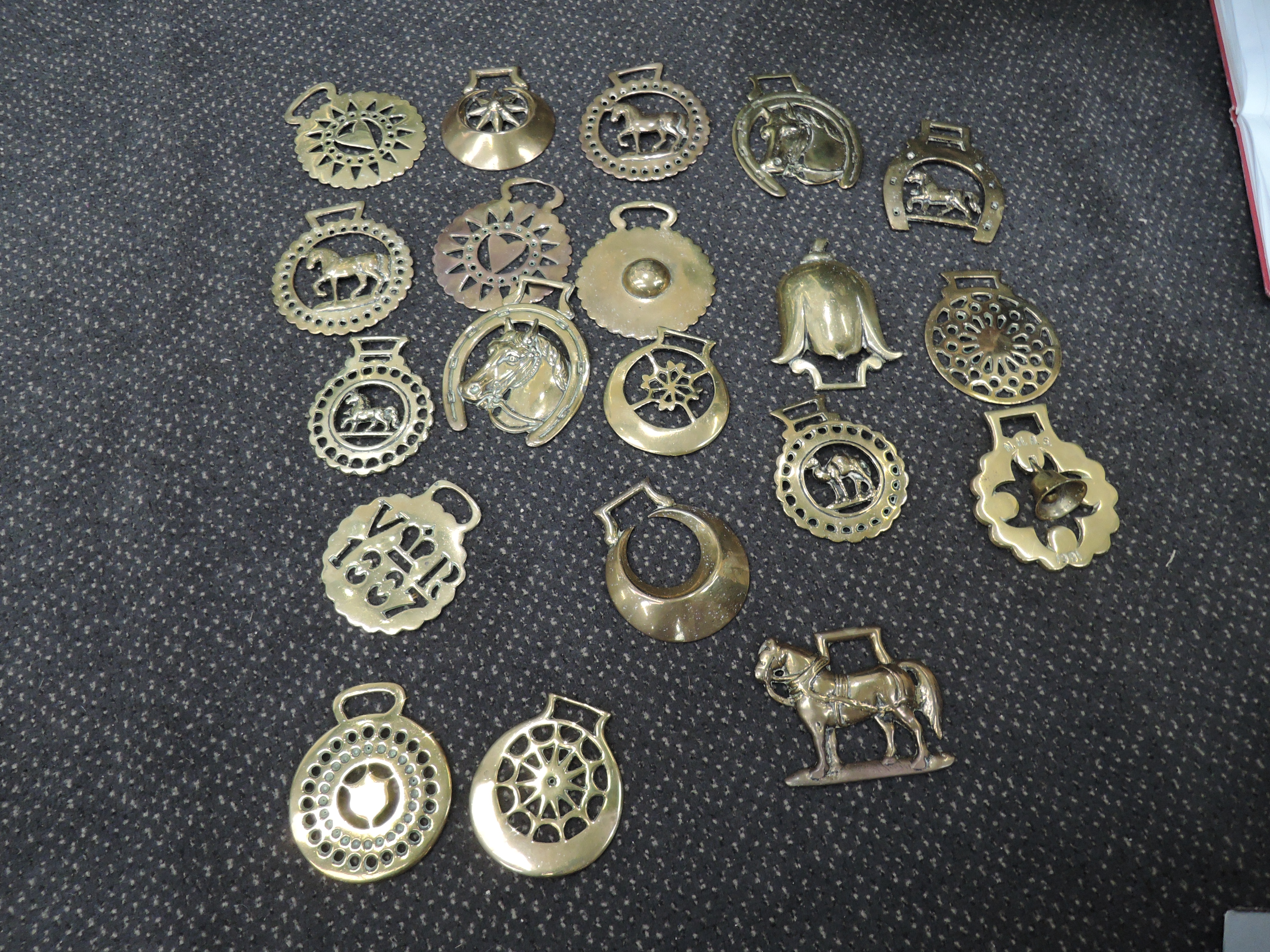 A collection of early and modern horse brasses, some on leather - Image 2 of 2