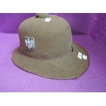 A World War II Third Reich German Africa Korps tropical pith helmet, Eagle and Swastika embossed