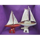 Two vintage Star Pond Yachts both having sails and stands, length 12 inches